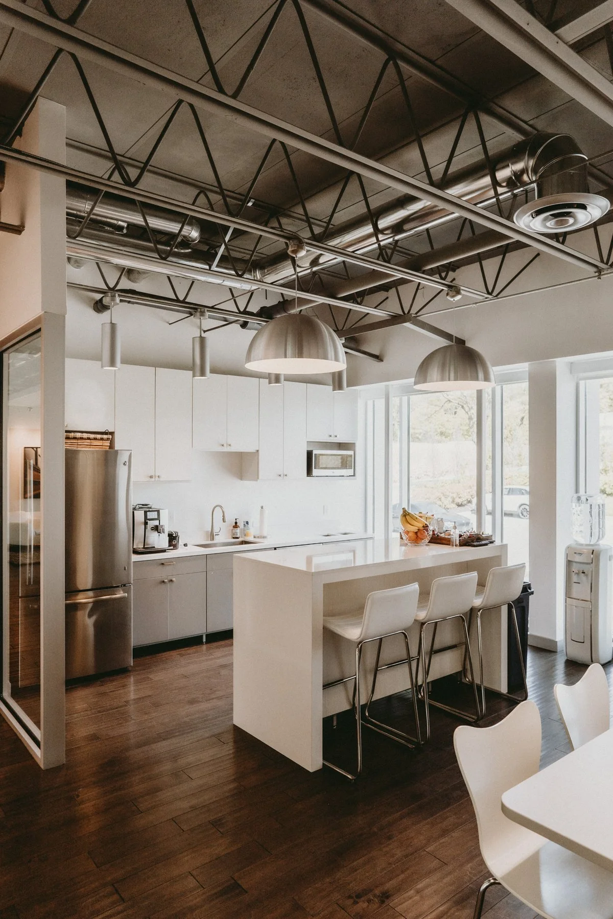 An open workspace with timber floors and exposed ceilings