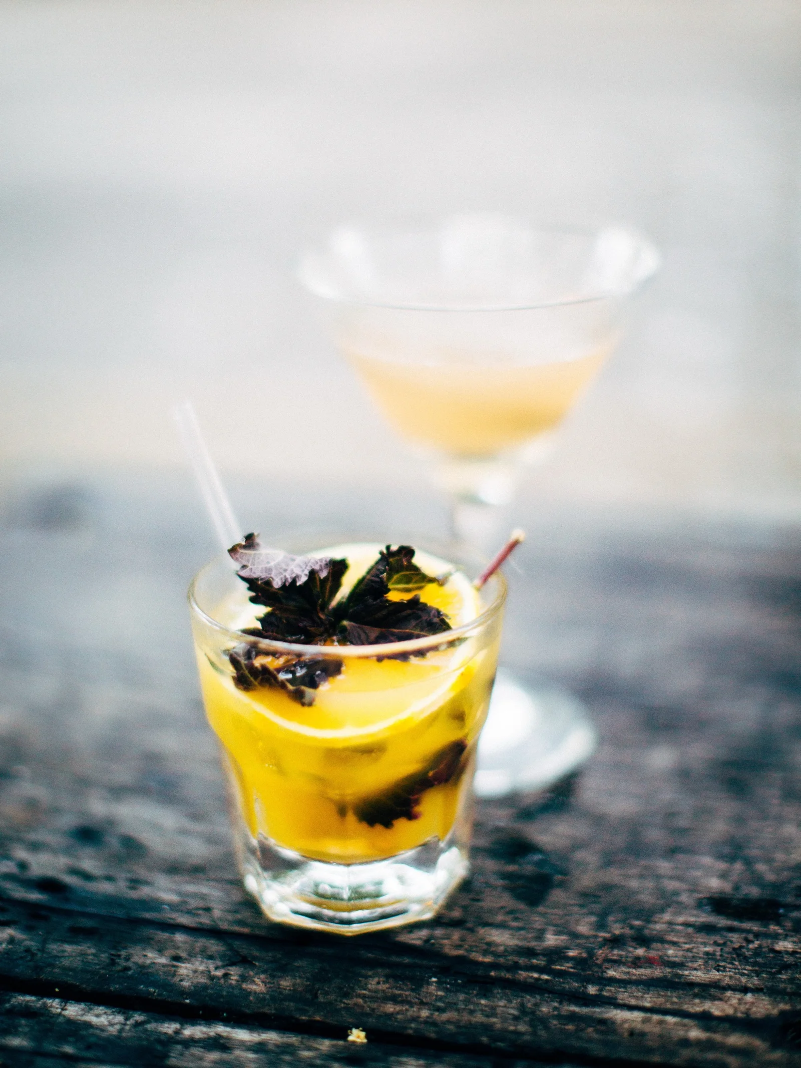 A bright drink on a weathered table